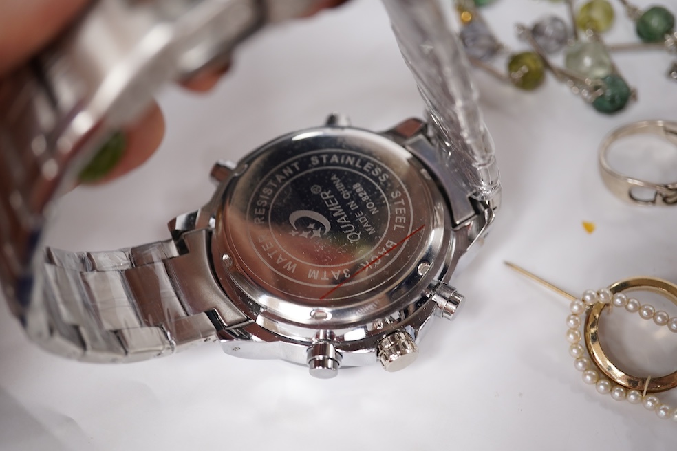 A small quantity of assorted mainly costume jewellery including a pair of malachite earrings and a graduated coral bead necklace, together with an Omega watch box and a gentleman's Quamer quartz wrist watch. Condition -